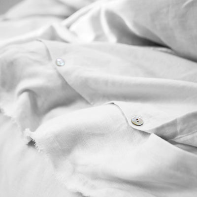 Frayed edge white linen duvet cover closure