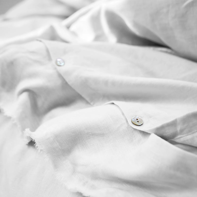 Frayed edge white linen duvet cover closure