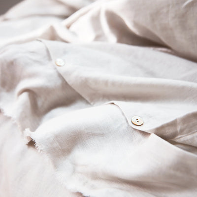 Frayed edge ivory linen duvet cover closure